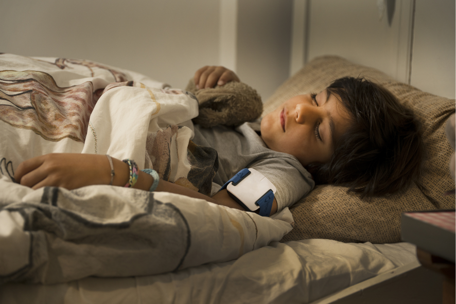Child sleeping with alarm watch
