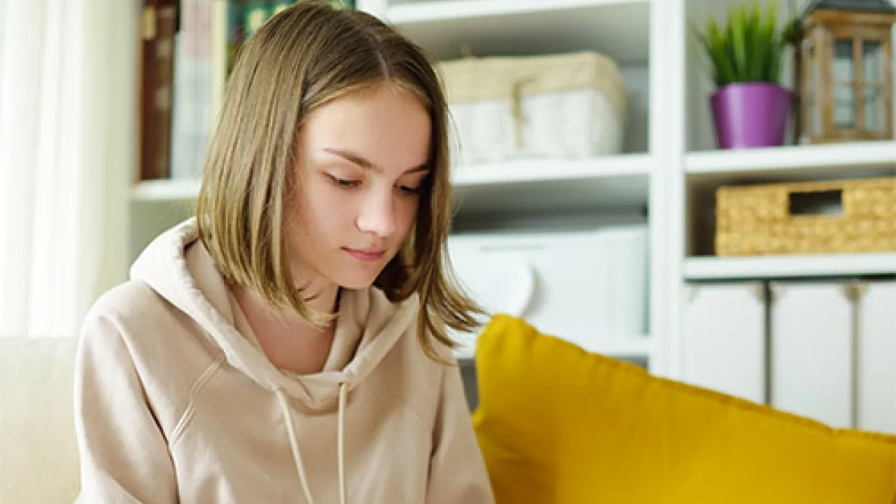 Autism girl on sofa