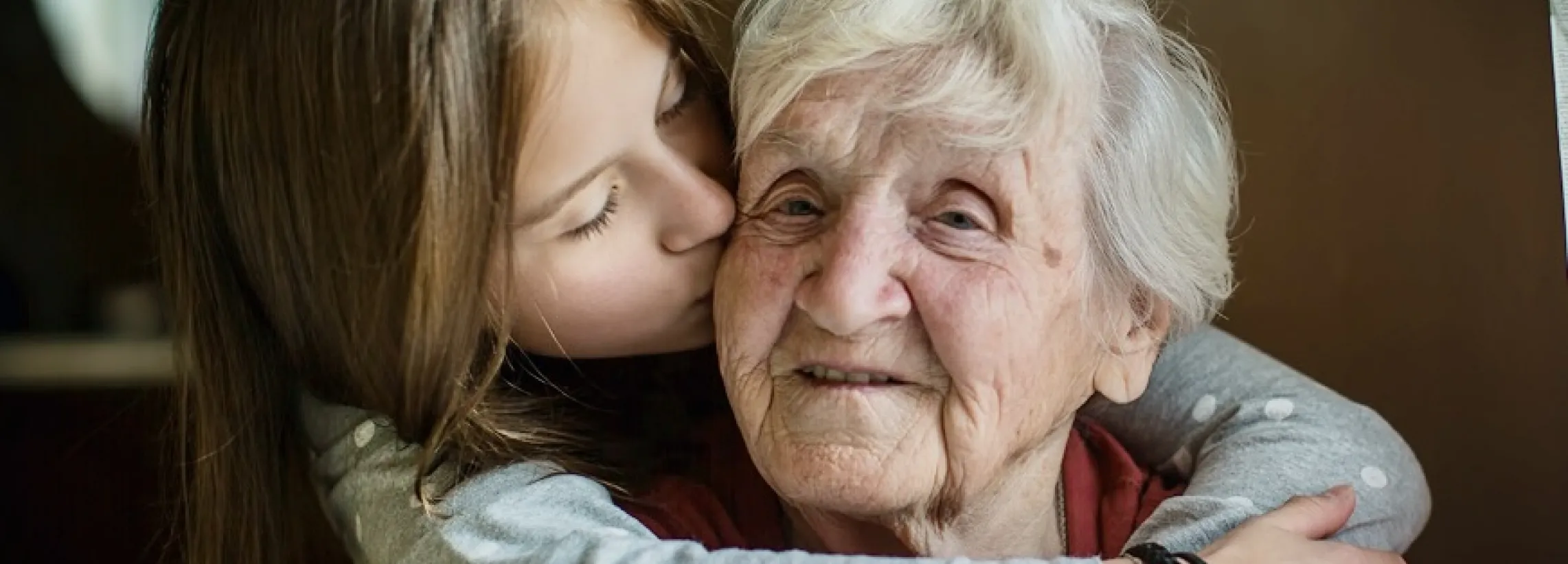 grandmother and grandaughter hug